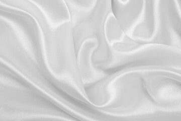 Fototapeta premium Smooth elegant white silk or satin luxury cloth texture as wedding background. Luxurious background design