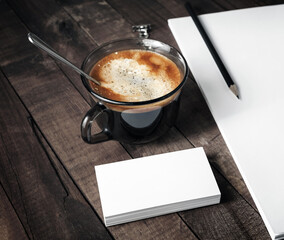 Blank business cards, coffee cup and pencil. . Branding template on wooden surface. Mock-up for your design.