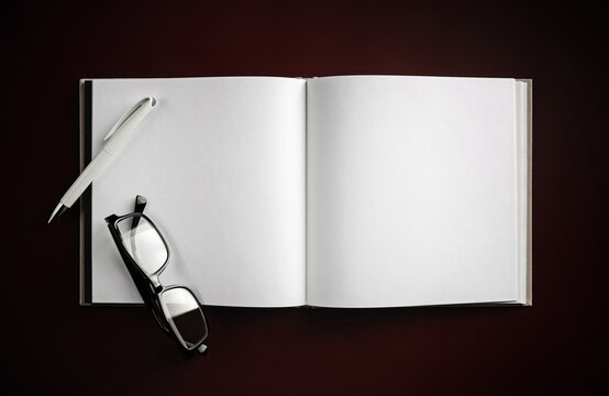 Blank book, glasses and pen mock up. Template for placing your design. Flat lay.