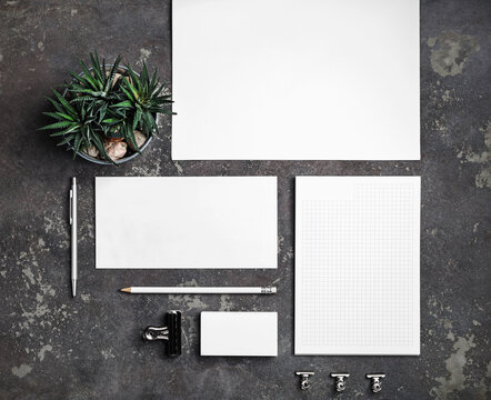 Blank corporate stationery set on concrete surface. Branding stationery mockup. Flat lay.