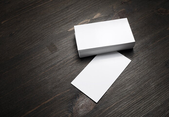Blank business cards template on wooden surface. Template for graphic designers portfolios.