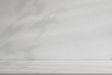 Minimalist white studio room background with soft leaf shadow overlay and copy space for product mockup