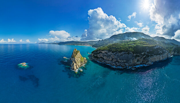 Aerial view of Corfu coastline with Ortholithi Rock and turquoise sea