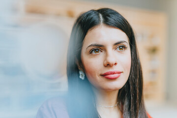 Confident businesswoman smiling in modern office portrait