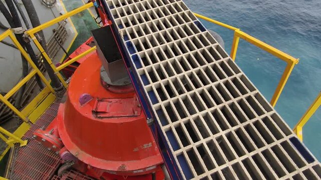 A screw conveyor (auger) used to transport drilling cuttings from solids control equipment  to a vertical cuttings dryer for fluid recovery and waste management
