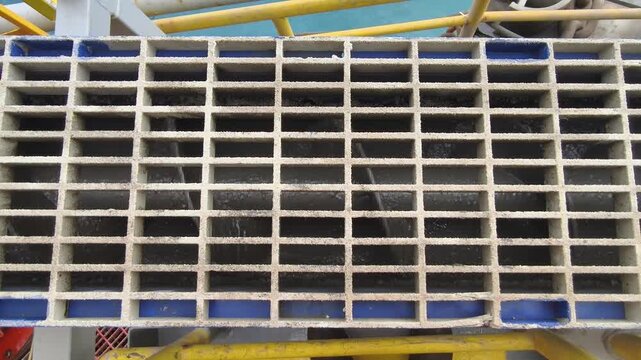 A screw conveyor (auger) used to transport drilling cuttings from solids control equipment  to a vertical cuttings dryer for fluid recovery and waste management
