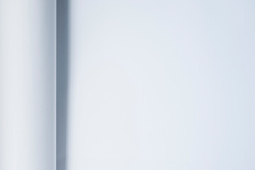 A sheet of paper in a cold blue tone.