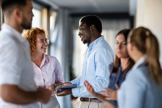 Business colleagues networking and sharing ideas at workplace
