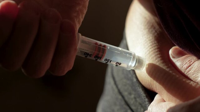 Patient Giving Subcutaneous Insulin Injection in Abdomen