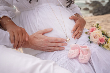 Hands Gently Holding Pregnant Belly