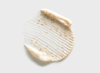 sample smear of cosmetic peeling cream on a light gray background close-up