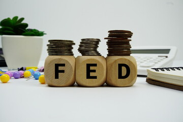 Stack of coins with wood blocks with 