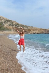 woman walking on the beach in Rhodes