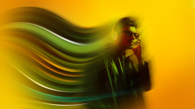 Modern poster abstract portrait of man wearing headphones with motion trails. Concept of music immersion, urban lifestyle, creative promotion for audio brands, media, technology.