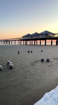 frozen Baltic Sea in winter season with sunset light