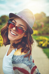 Obraz premium Portrait, woman and happy with sunglasses outdoor for travel, spring adventure and holiday trip. Smile, female person and explore nature with eyewear, sunshine and vacation getaway in countryside