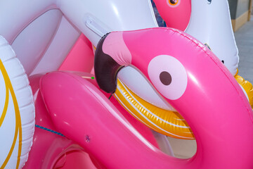 Group of inflatable bird floats displayed at a summer holiday shop