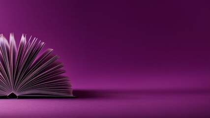 open hardcover book with symmetrically fanned pages captures the essence of curiosity and discovery against a solid deep purple background.