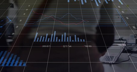 woman using smartphone at office desk, displaying business data via holographic charts - Powered by Adobe
