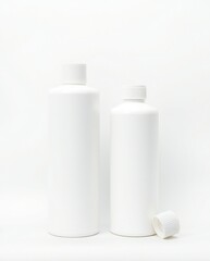 Two white plastic bottles with caps