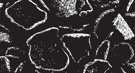 Close-up of a high-contrast black and white cobblestone texture with irregular stone pattern.