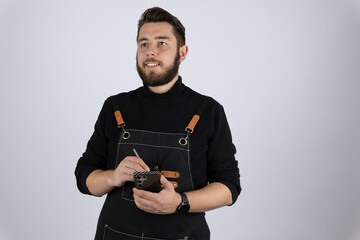 Waiter using a tablet to manage restaurant bookings