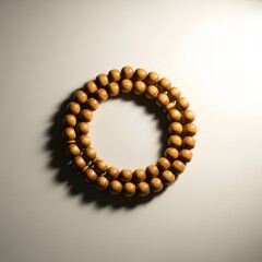 Obraz premium Wooden prayer beads on a light background, traditional Islamic rosary