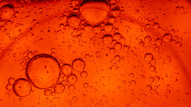Abstract macro shot of oil drops on water