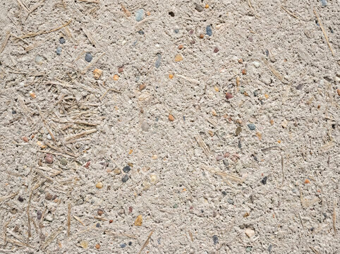 Macro texture of sustainable hempcrete with organic plant fibers and stone aggregate. Eco-friendly industrial building material background with copy space