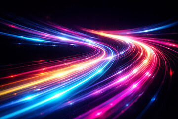 Colorful bright curved light streaks flow dynamically on a dark background, creating smooth, glowing trails in pink, blue, orange, and purple hues with sparkling highlights.