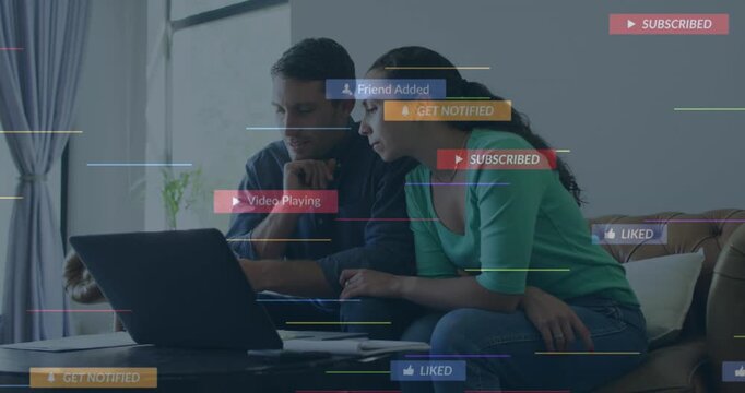 A young couple is talking and paying their bills using a laptop