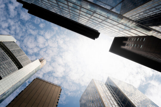 Frankfurt Germany finance business corporate skyscraper architecture office modern downtown sun flare between skyscrapers with bright sky and leading lines