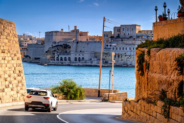 Concept European road trip along the coast of island with view of historic city, Valletta, Malta. © Tomasz