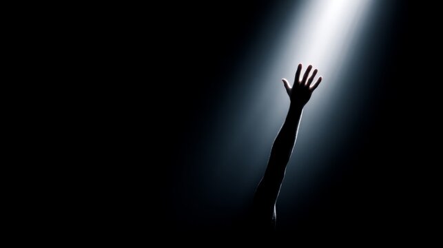 Person&rsquo;s hand hope, partner, strength, togetherness, trust, believe, Embracing Belief - Artistic Silhouette of Hand Reaching from Darkness into Light Symbolizing Hope and Faith