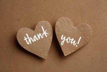 Rustic Heartfelt Gratitude: Two Paper Hearts Conveying Thanks on Brown Background