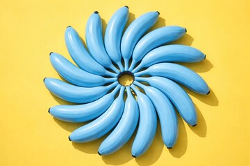 Blue Bananas in Spiral on Yellow: Abstract Fruit Composition and Pattern
