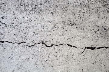 Abstract grunge texture of broken white painted cement floor.