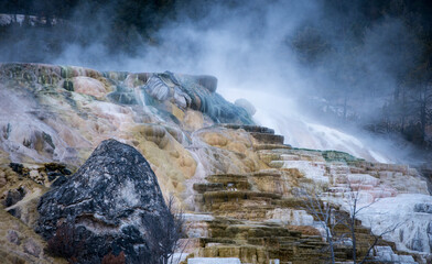 Geyser at Yellowstone park in Autumn 