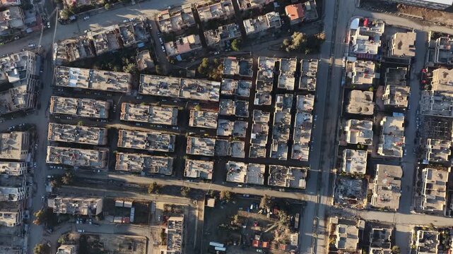 Drone shot overlooking the city of Deir ez-Zor in eastern Syria. The footage captures the urban landscape, traditional architecture, and the strategic flow of the Euphrates River.