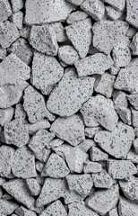 Close-Up of Rough, Porous Gray Pebbles
