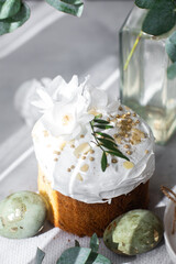 Traditional Easter cakes and painted eggs in white colors .Easter Kulich 