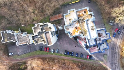 Top-Down Aerial View of Residential Apartment Complex With Parking Area