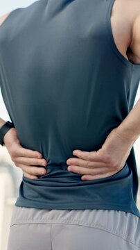 Hands outdoor, massage and back pain from exercise challenge, difficult workout and medical issue. Active, man and athlete stretching with inflammation, strain and fitness problem from spine injury.