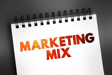 Marketing Mix - foundation model for businesses, historically centered around product, price, place, and promotion, text on notepad, concept background