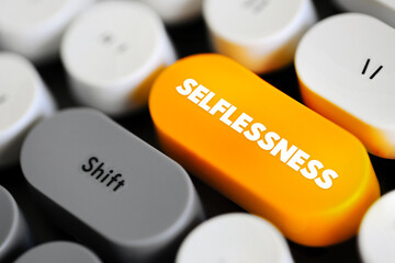 Selflessness - concern more with the needs and wishes of others than with one's own, text concept button on keyboard