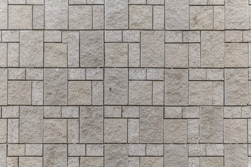 abstract background of grey stone tiled wall texture close up