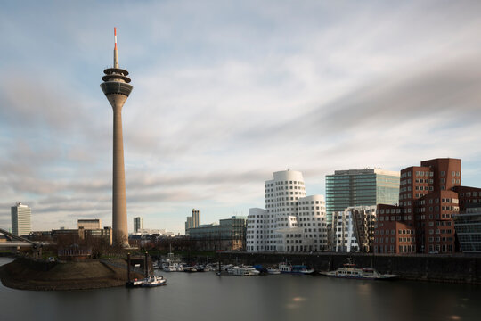 DUSSELDORF, GERMANY - DECEMBER 26, 2015: View of the Neuer Zollhof in Media Harbor in Dusseldorf, Germany. This building complex was designed by Frank O. Gehry and completed in 1998