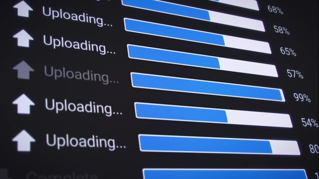 Video animation of the process of uploading multiple files from the Internet on a computer monitor screen. A computer monitor displaying information about the data upload in real time, including perce