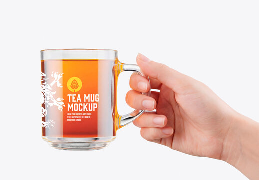 Hand Holding Glass Tea Cup