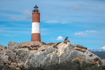 Faro Les &Eacute;claireurs, a lighthouse on a rock island with many sea lions near Ushuaia, Argentina